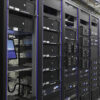 Many powerful servers running in the data center server room. Many servers in a data center. Many racks with servers located in the server room. Bright display a plurality of operating equipment. Network Racks, Power & Tools